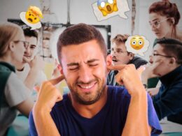 A man with his fingers in his ears