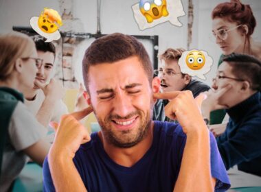 A man with his fingers in his ears