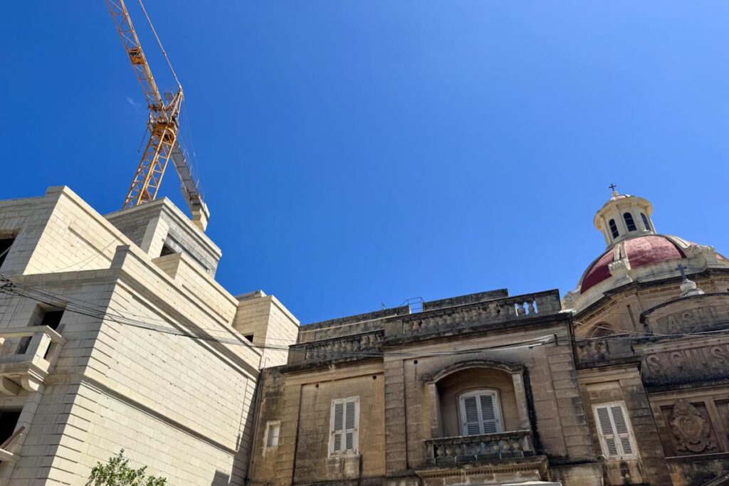 A church dome and a crane