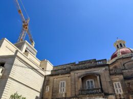 A church dome and a crane