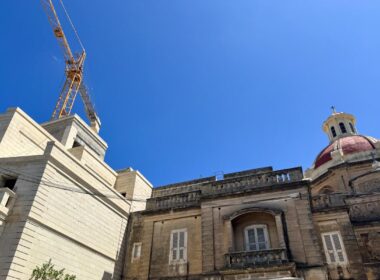 A church dome and a crane