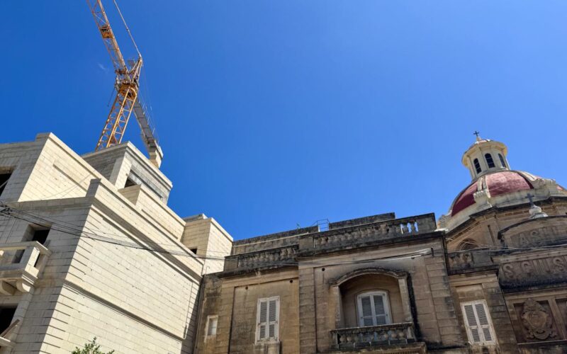 A church dome and a crane