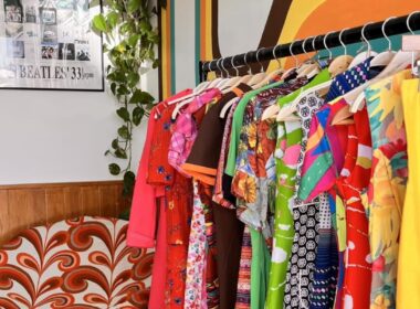 Brightly coloured garments on a rail