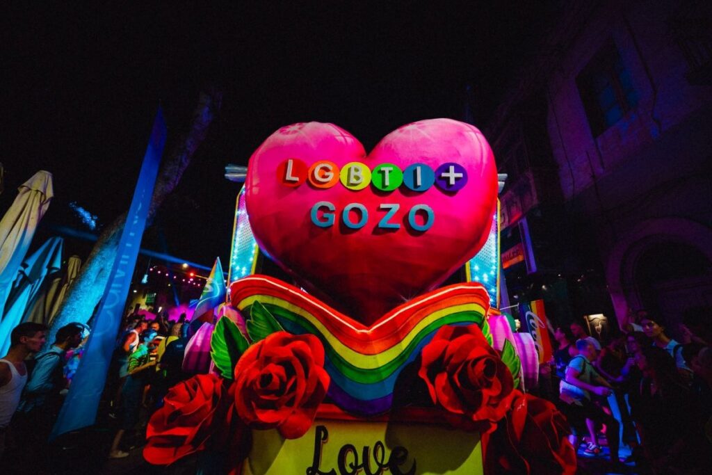 A big pink heart with LGBTI+ Gozo writen on it