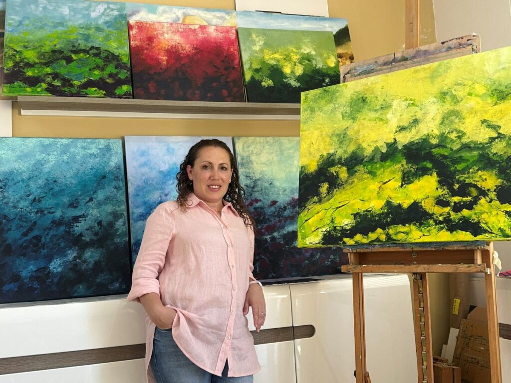 Elaine Mifsud with her art