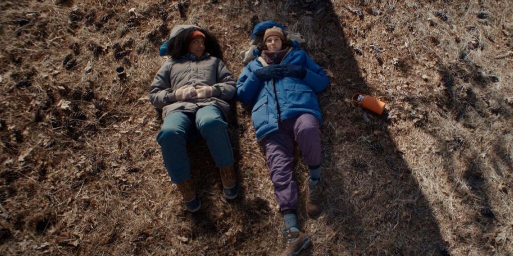 Two people lie on the ground