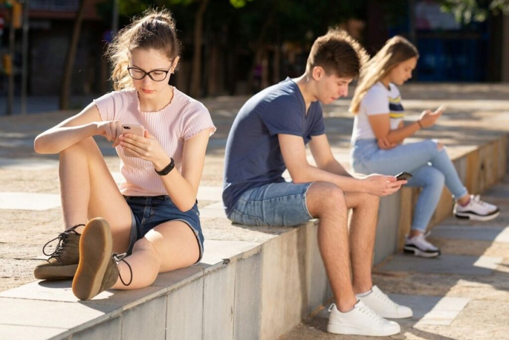 Teenagers on their phones