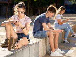 Teenagers on their phones