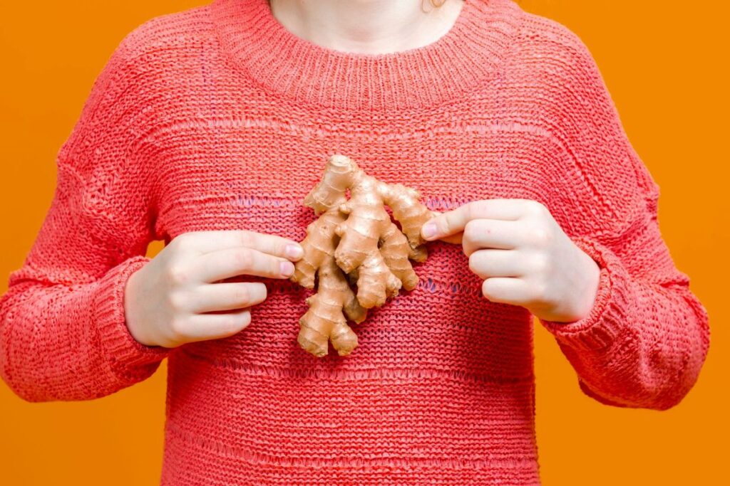 a person holding some ginger roort