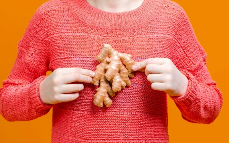 a person holding some ginger roort