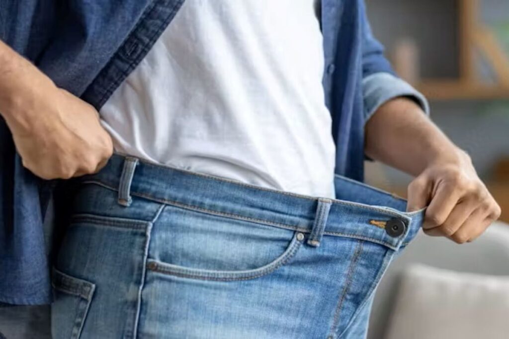 A person showing a very loose waistband
