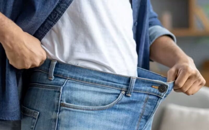 A person showing a very loose waistband