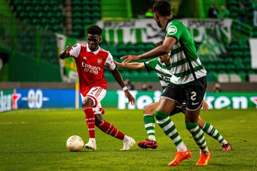 Footballers in red and green
