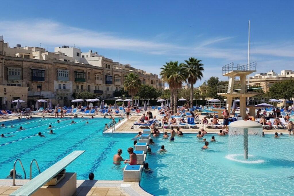 a swimming pool in the summer sun