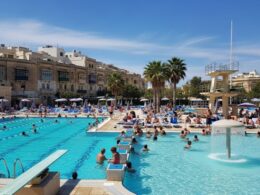 a swimming pool in the summer sun