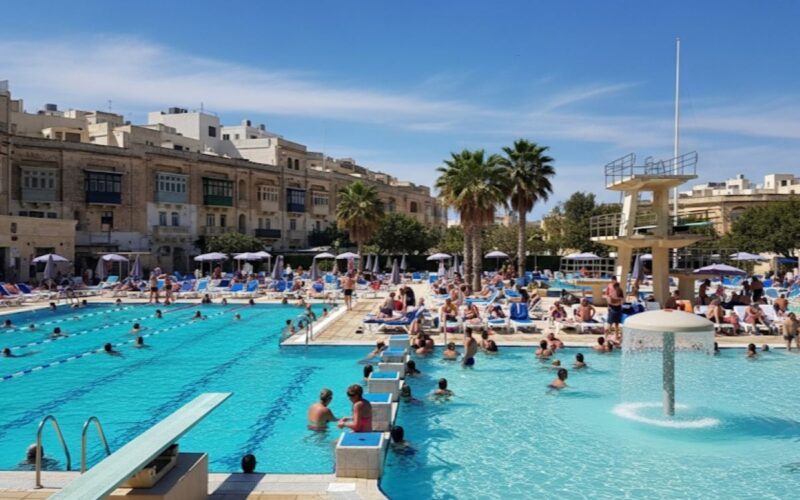 a swimming pool in the summer sun
