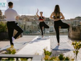 three people doing yoga