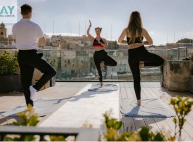 three people doing yoga