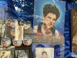 Carlo Acutis souvenirs displayed in a shop window