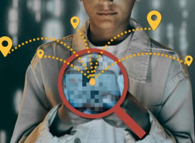 A person looks at a phone that is tracking them