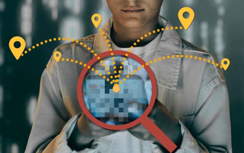 A person looks at a phone that is tracking them