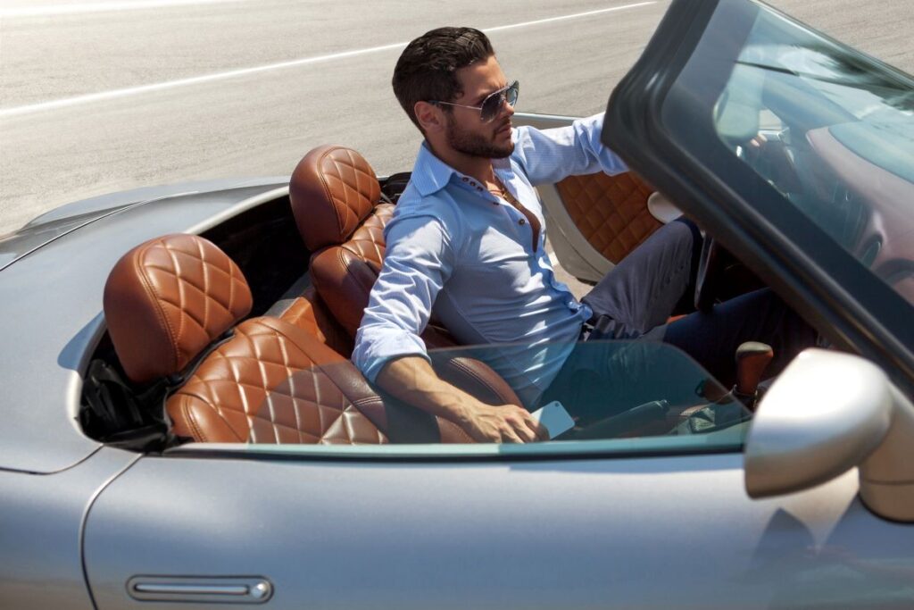 a man in a fancy car