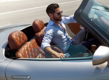 a man in a fancy car