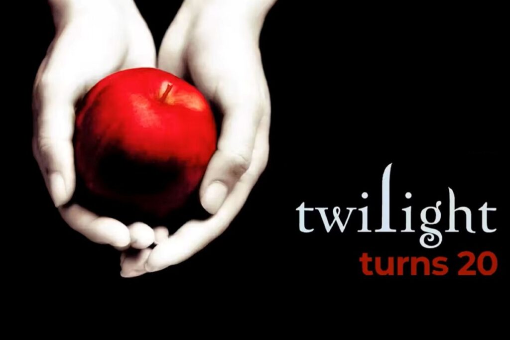 a red apple in a pair of white hands