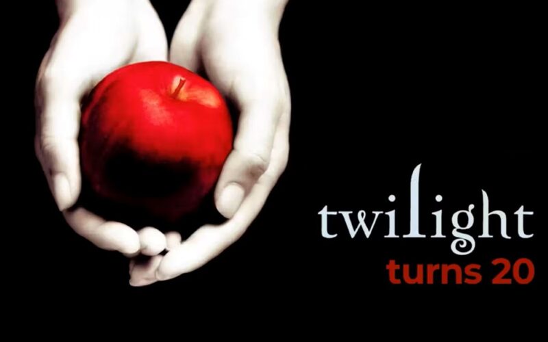 a red apple in a pair of white hands