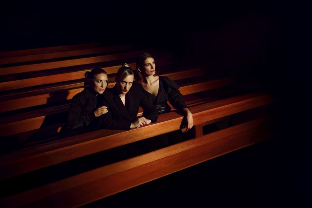 Three women in corporate suits