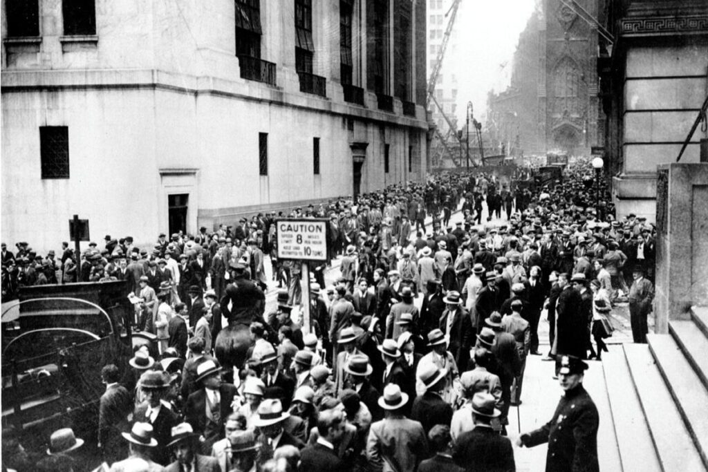 A crowd gathers outside the New York Stock Exchange following the ‘Great Crash’ of October 1929.