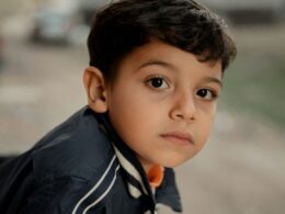 A young boy looks pensive