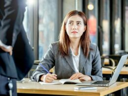 An employee looks apprehensive in an office