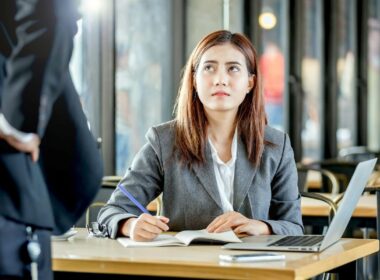 An employee looks apprehensive in an office