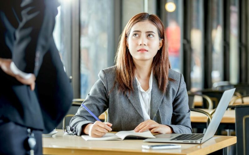 An employee looks apprehensive in an office