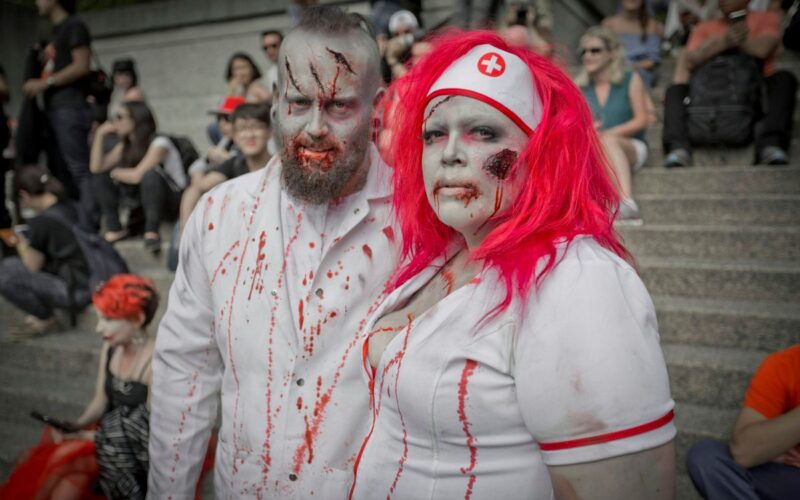 Two people dressed as Zombies